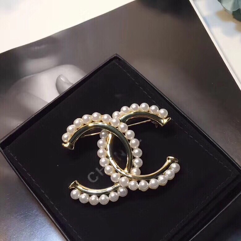 Ch*el brooches